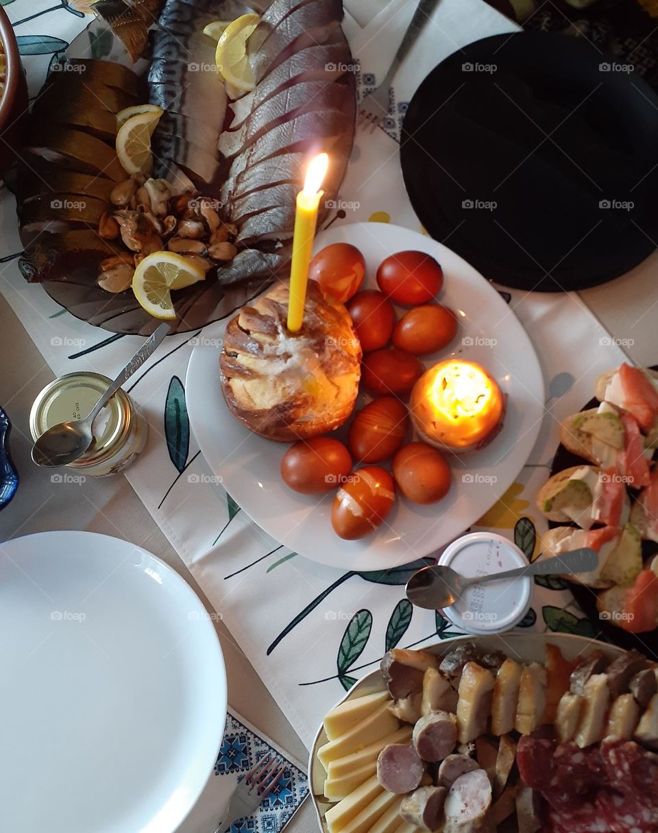 Festive Easter dinner of bread, eggs and fish