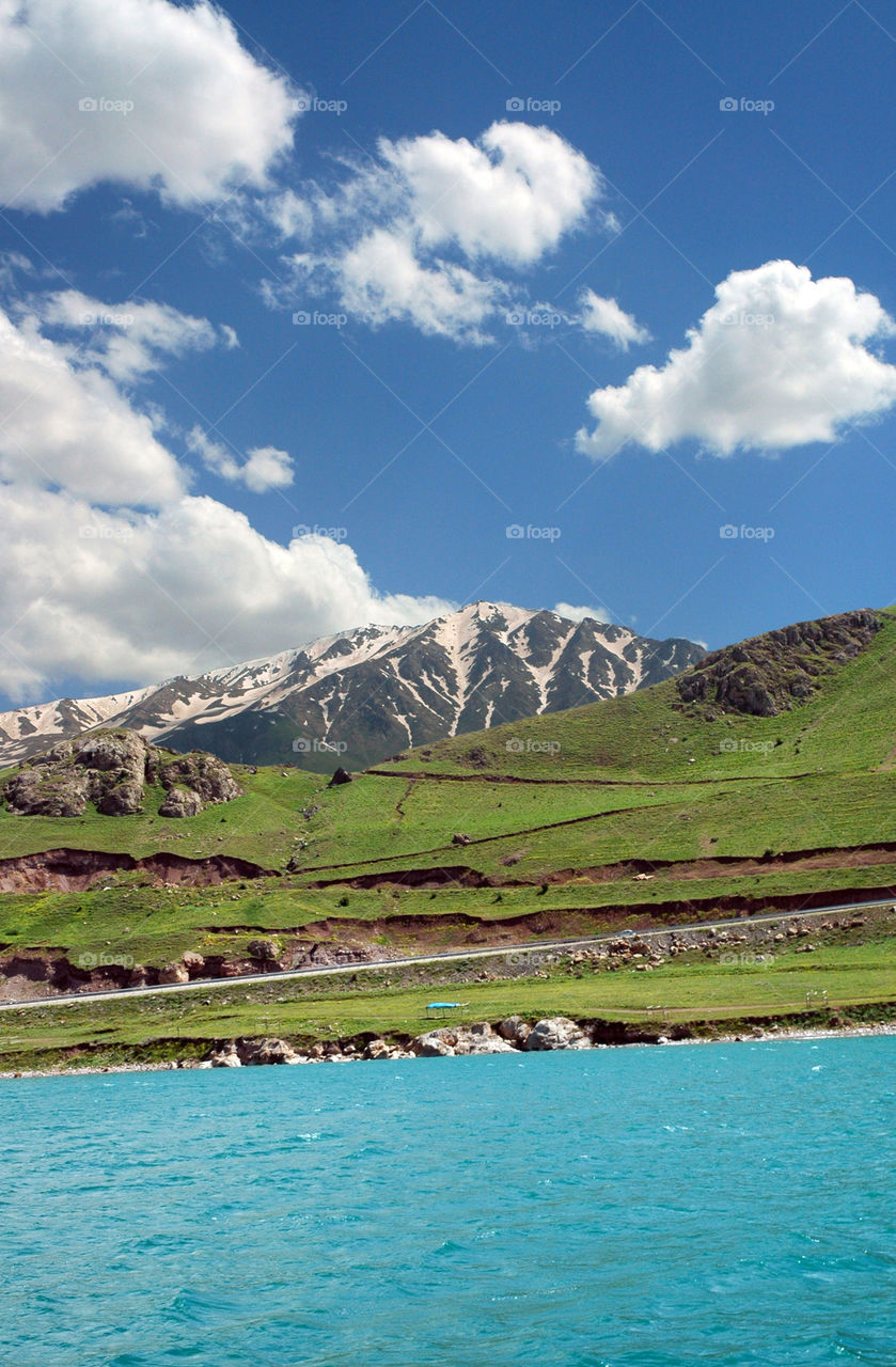 Snowy mountain on spring