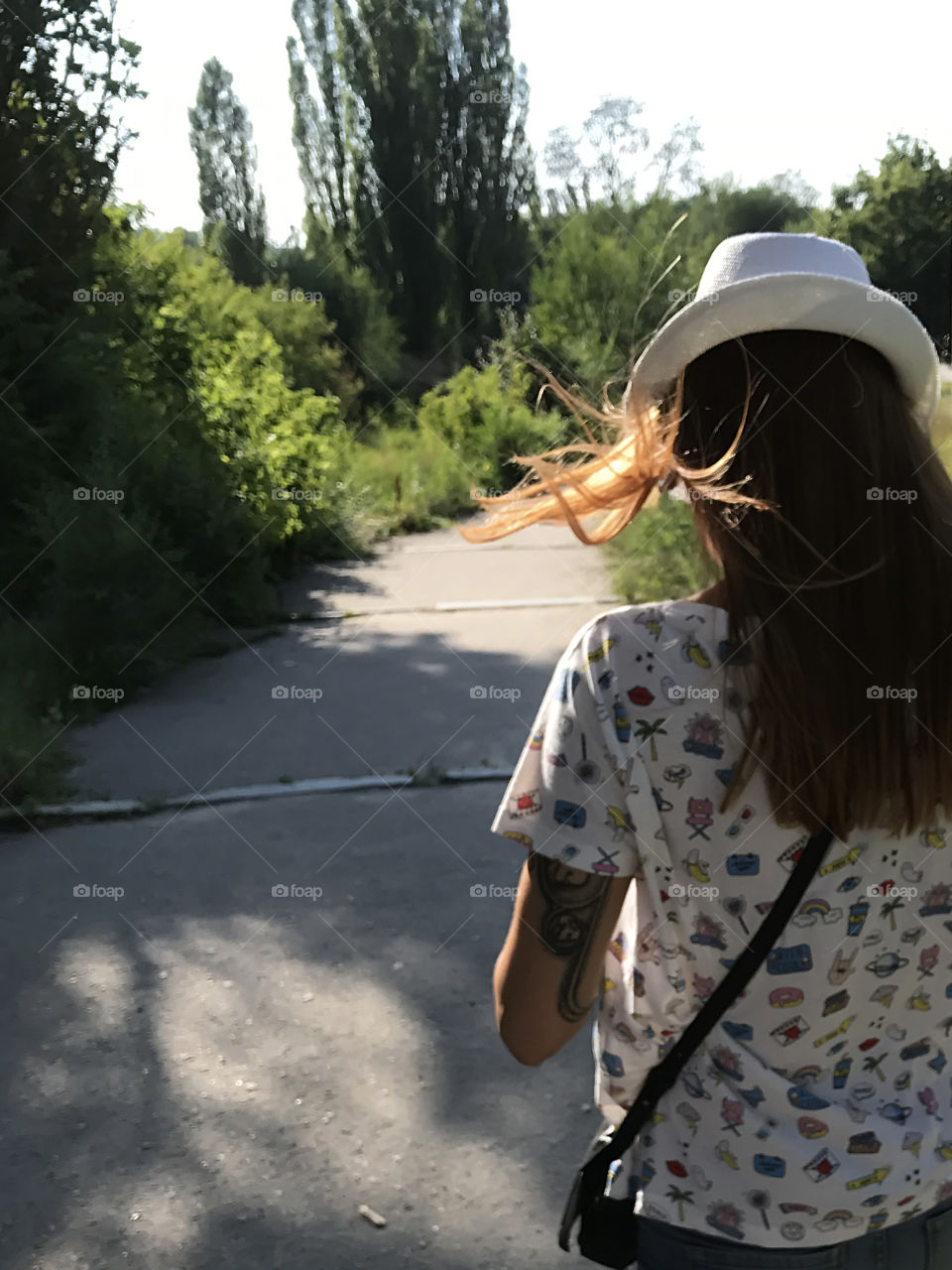 Enjoying the last summer days walking in the city park 