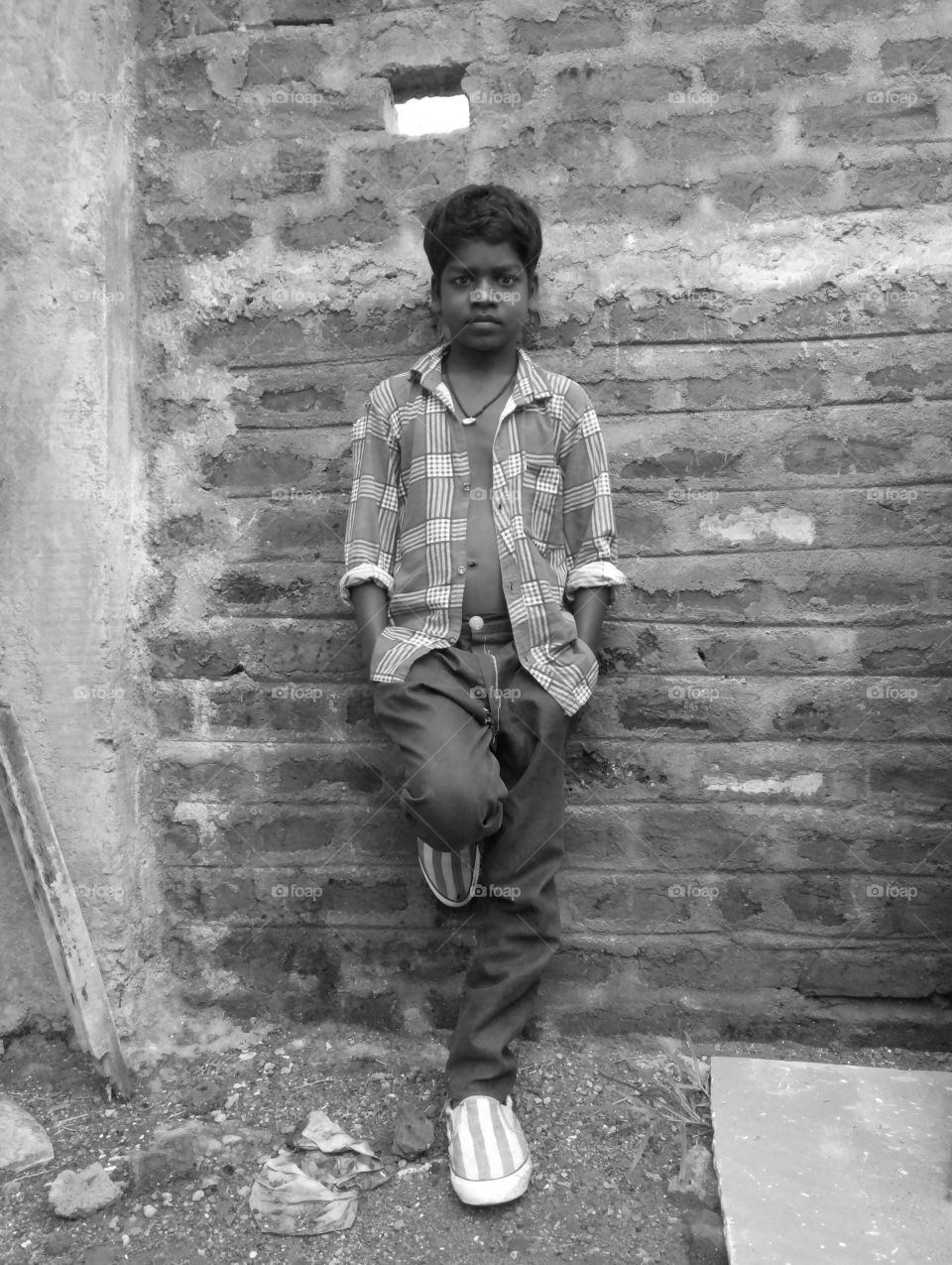 Photographs of a boy /Photograph of an Indian boy/Photograph of a boy wearing a shirt/ Photograph of a boy wearing a red shirt / Photograph of a Hindustani boy/ Photograph of a poor boy/ Photograph of a decent boy