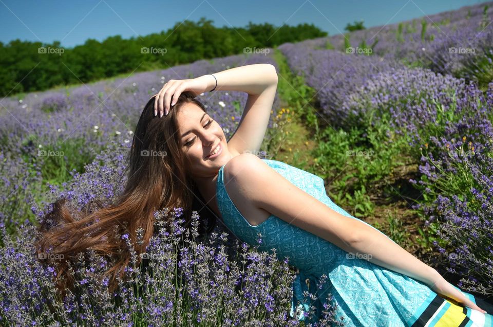 Woman with beautiful natural hair on lavender fields