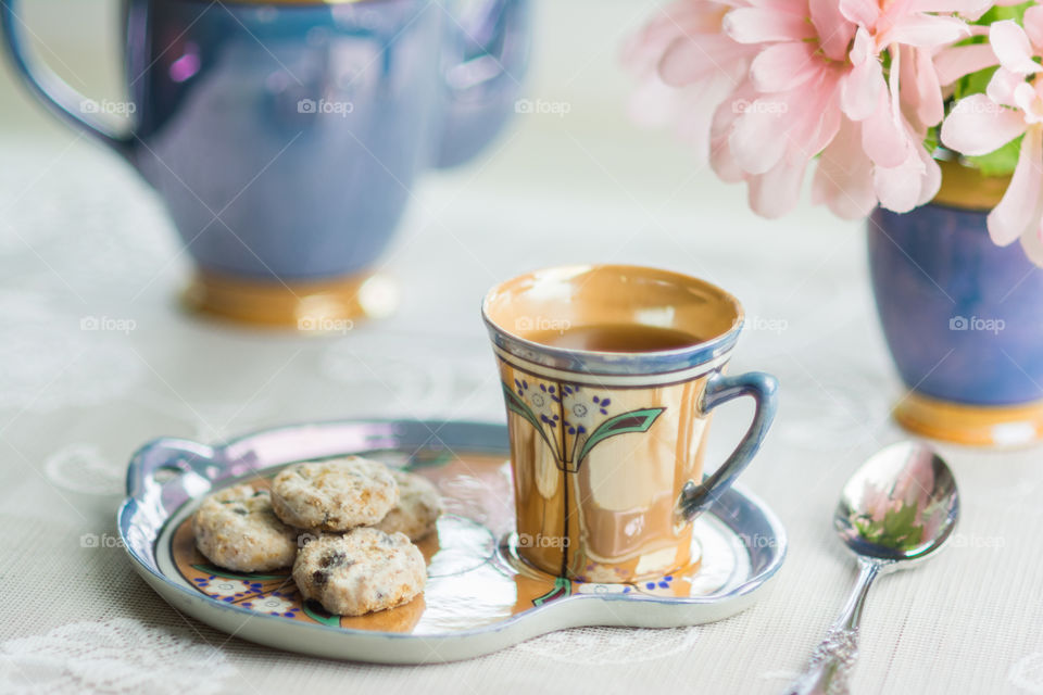 Close-up of cookies and cup of tea