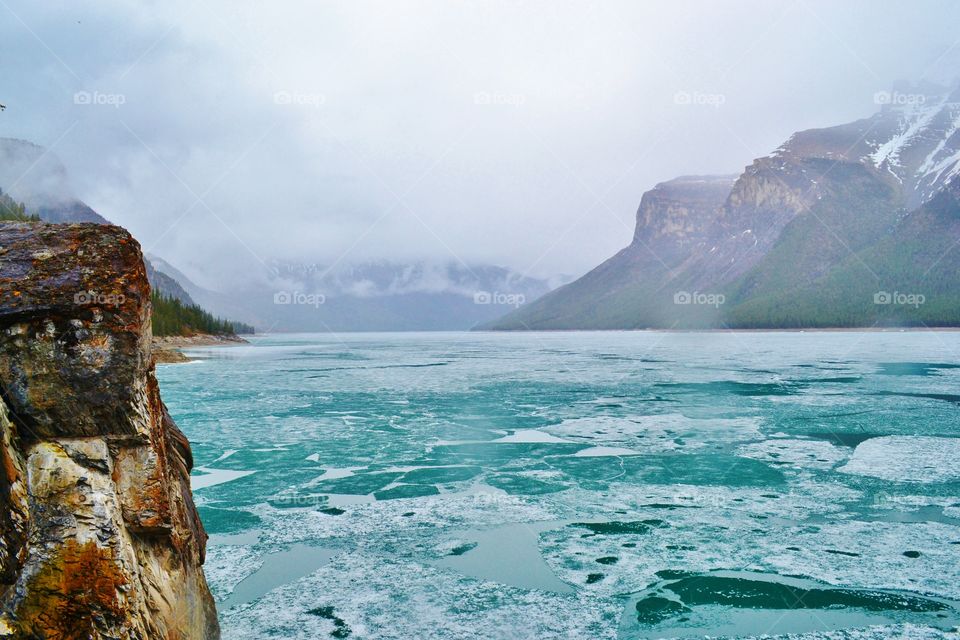 Lake Minnewanka, Alberta becomes a thick sheet of frozen ice each winter. In the spring, the melt starts to break the ice apart, leaving quite a breathtaking view! 