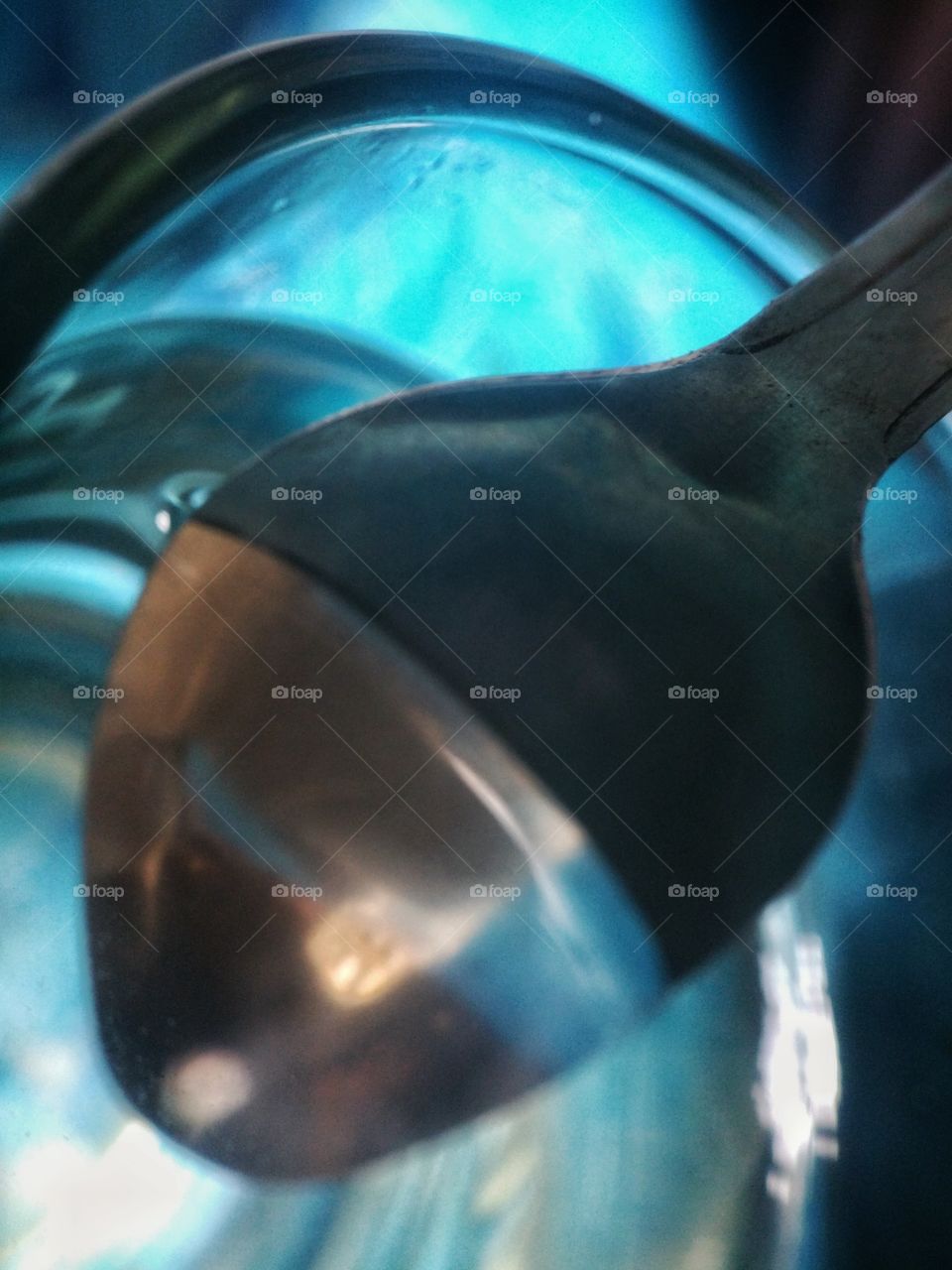 spoon in a glass filled with water