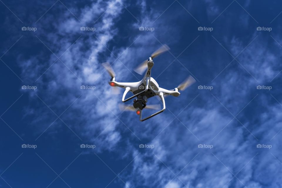 Drone flying in sky