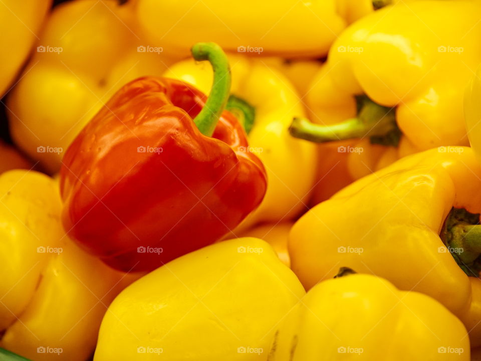 Red sweet pepper on yellows