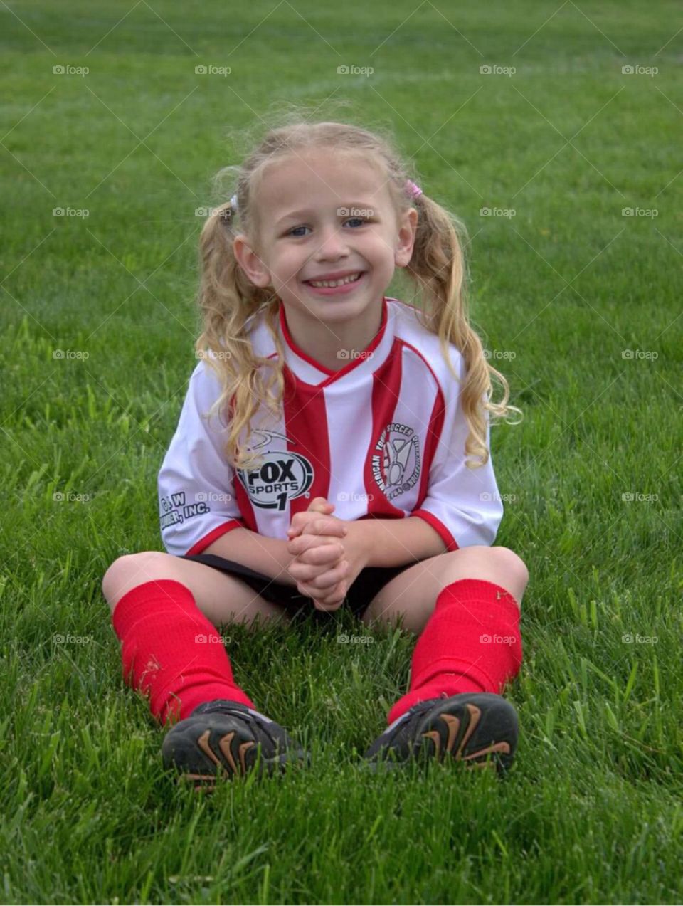 My sweet little soccer star posing for her picture. 