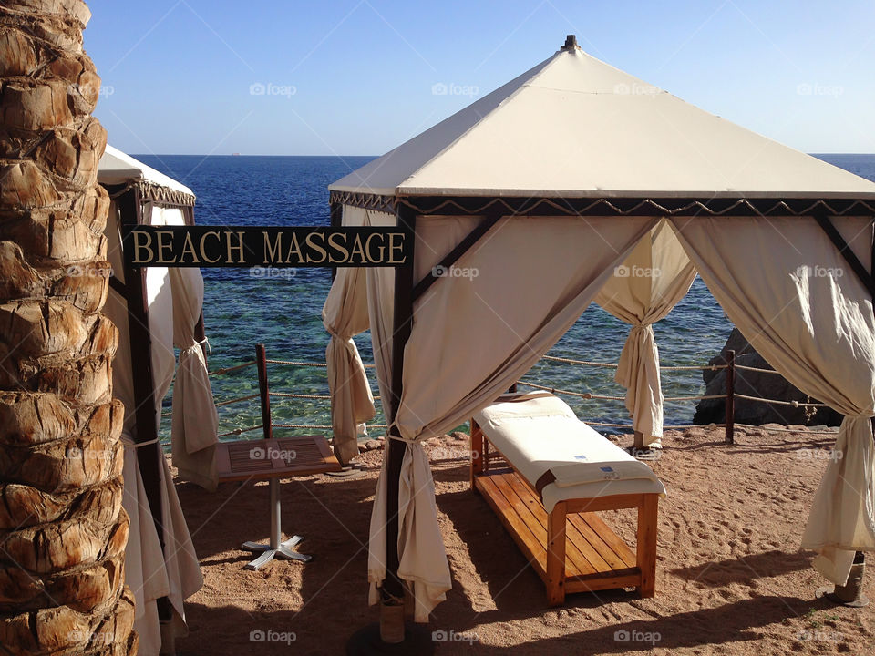 Enjoying the last summer days with a beach massage 