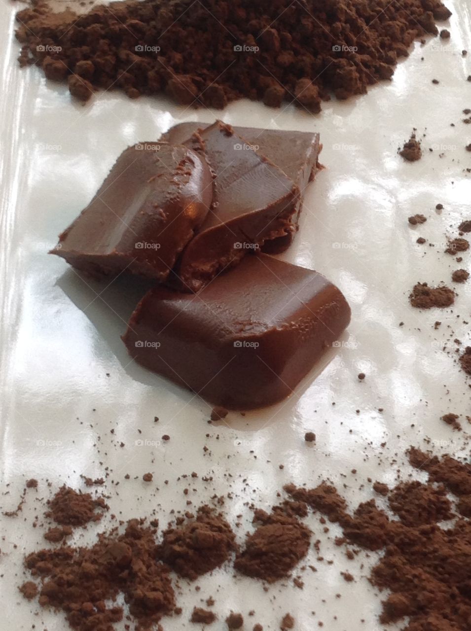 Pieces of fudge with cocoa powder.