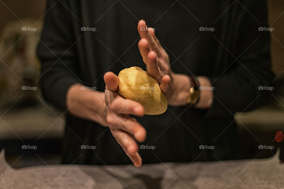 Close up of woman holding dough