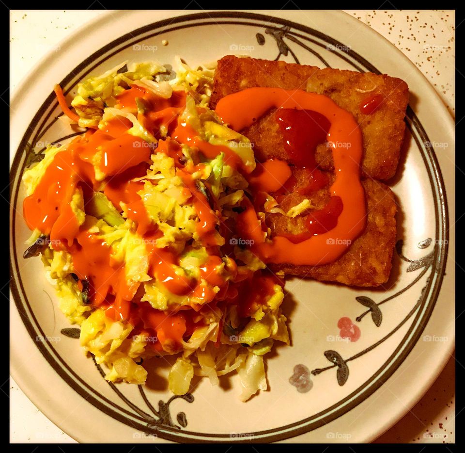 Scrambled egg, coleslaw and hash brown supper at home.