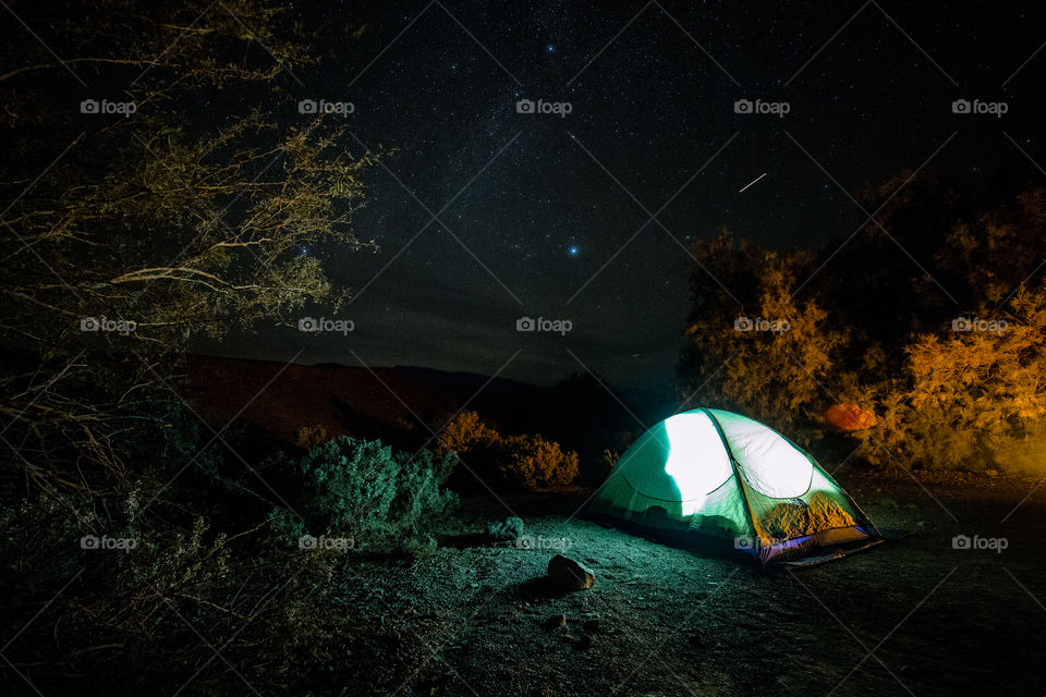 Camping under the night sky and stars.