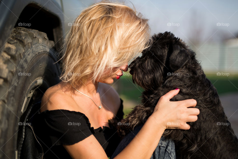 Cute blond girl with her dog