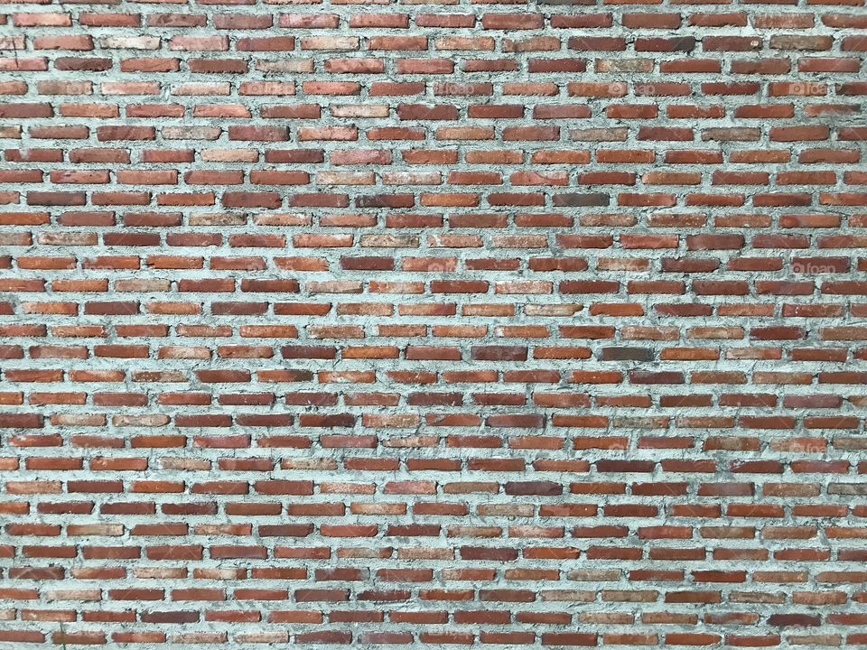 Clay-brick wall with brown-red color