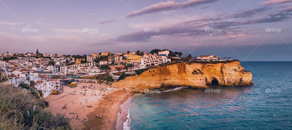 Carvoeiro town and beach in Lagoa, Algarve, Portugal. Panorama photo taken on a hot summer day of August.