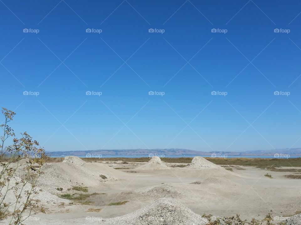 Mounds of shells on beach. San Francisco Bay beach. Mounds of shells on beach used by bycyclists as bike park.