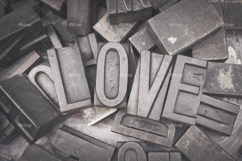 LOVE. Block of wooden letters spell as LOVE. processed in black and white for retro concept. 