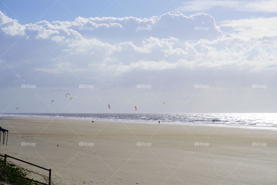 Beautiful beach with kitesurfers in São Luís, Brazil 