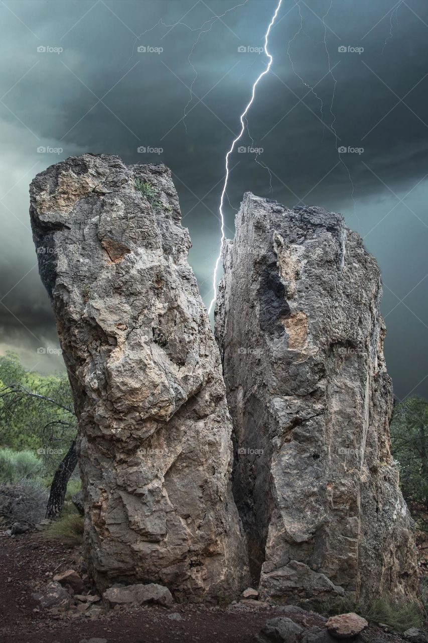 A very beautiful view, lightning between two rocks.