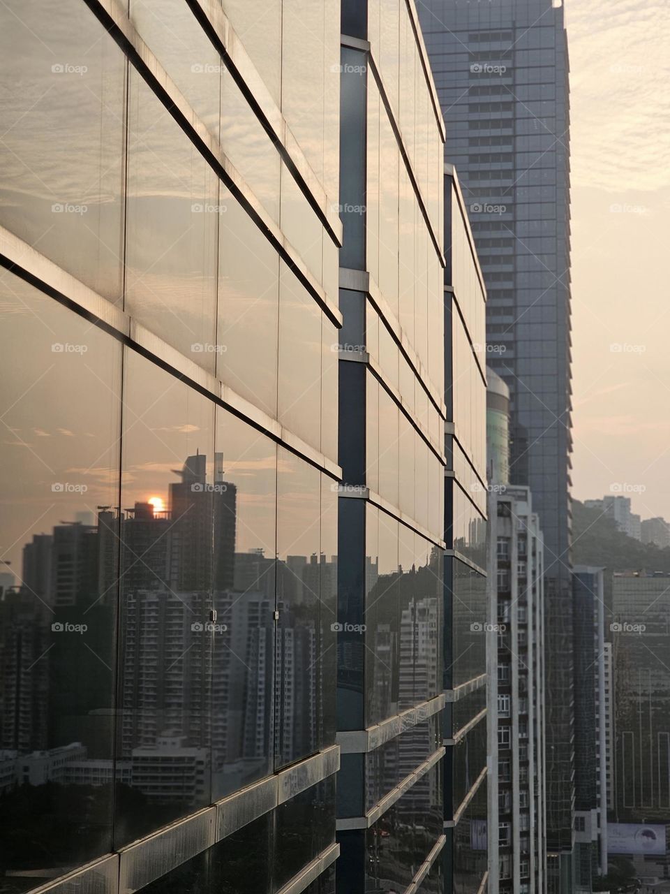 sunset reflected on a building in Hong Kong