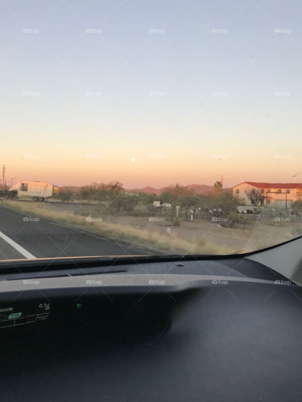 Moon goes down as sun comes up 