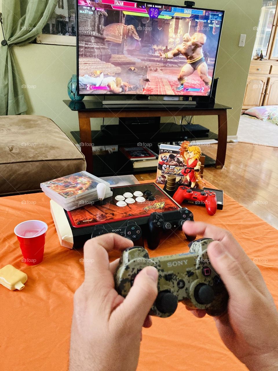 Man playing street fighter video game photography mission 