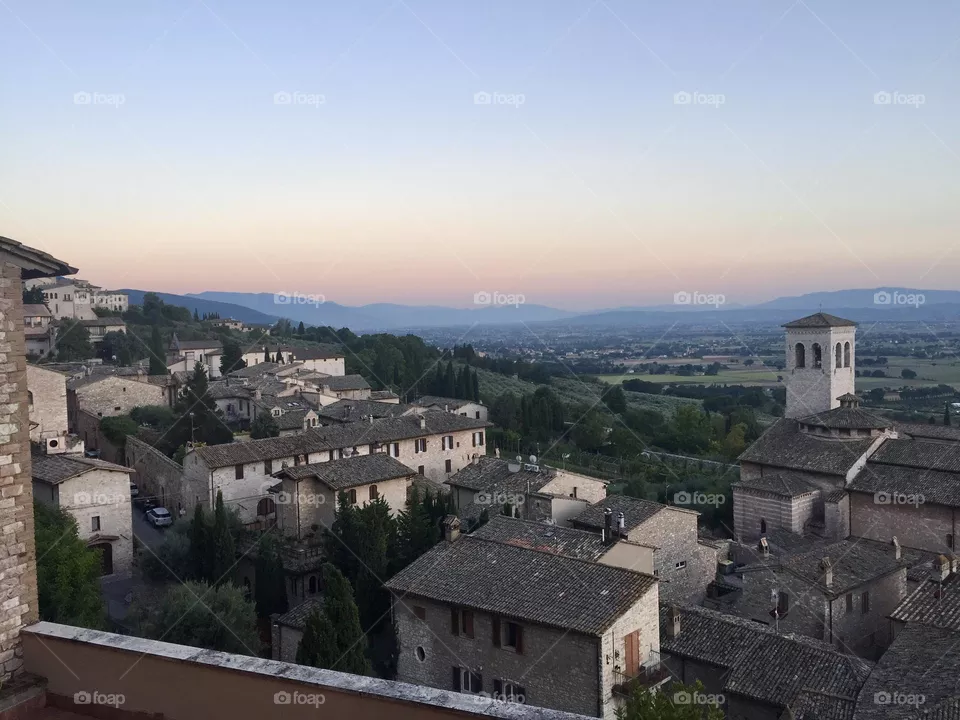 Dawn sun rising in Assisi, medieval italian village in Umbria