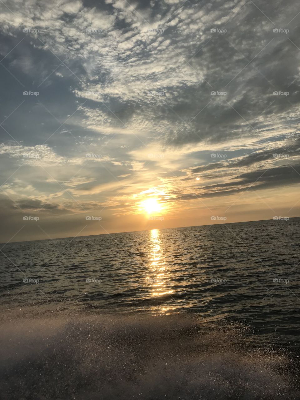 Off shore ocean fishing trip with a beautiful sunset 