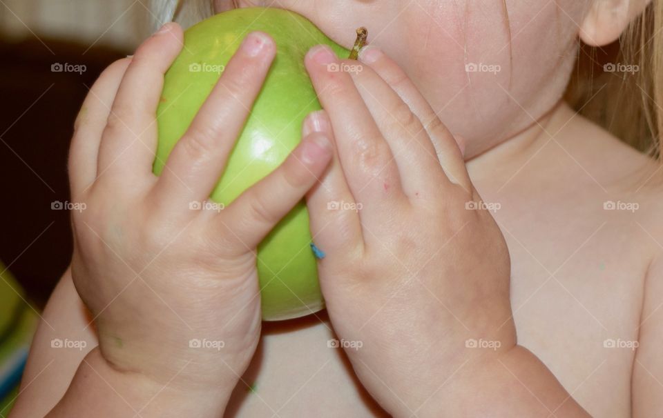 Eating a green apple 