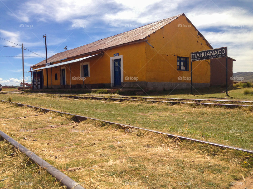 Old yellow train station at Tiwanaku, La Paz in Bolivia