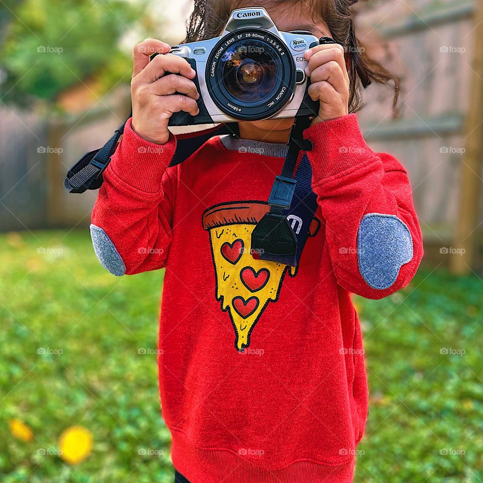 Toddler girl focused camera on subject, toddler using film camera, toddler and Canon camera, Canon Rebel camera, pizza drip sweatshirt 