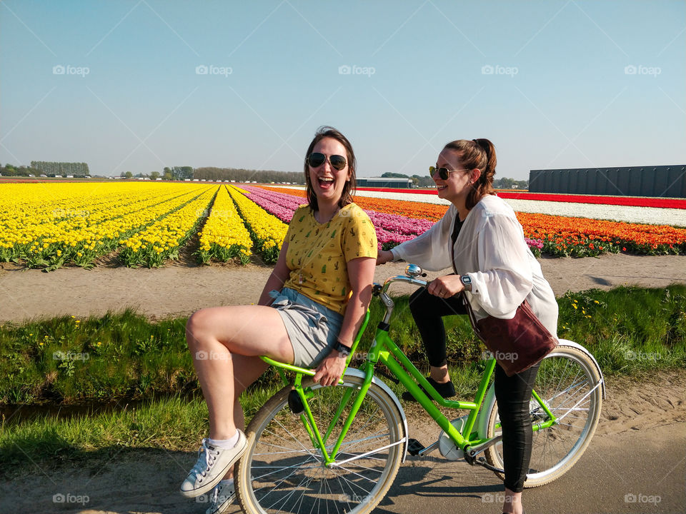 Dutch girls having fun with a bike