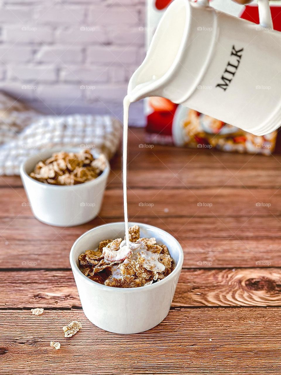 Milk pouring in cereal.