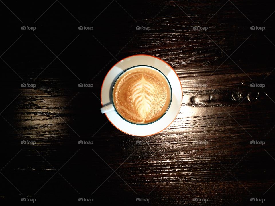 Cappuccino on wooden table