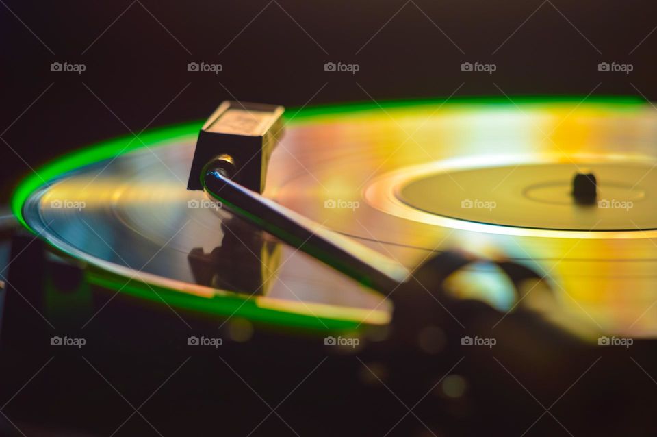 disk of an old loudspeaker in different colors, long exposure photo with light trails