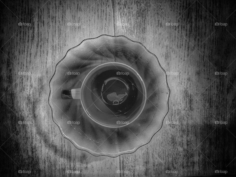 Empty coffe cup in a bowl