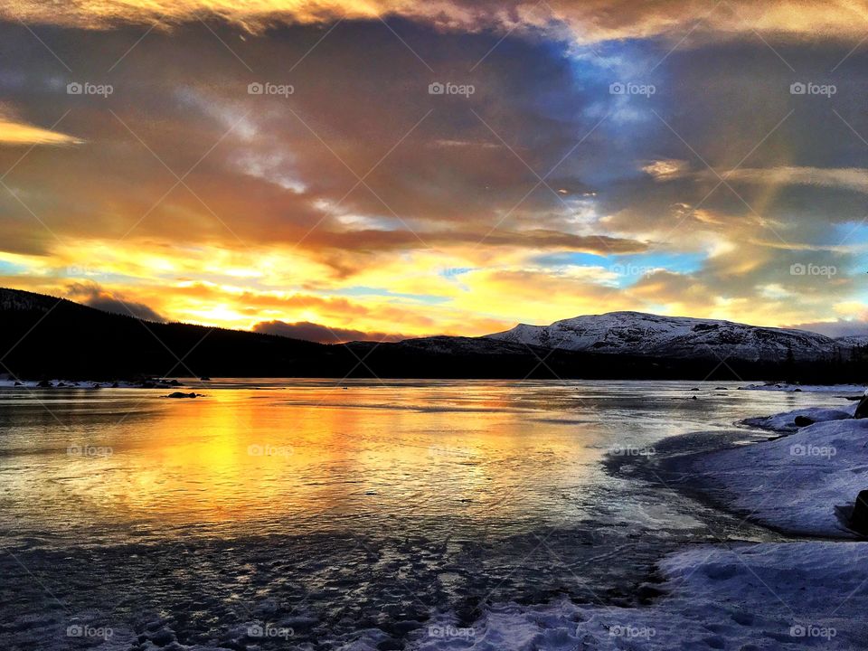 Sunset on winter lake 