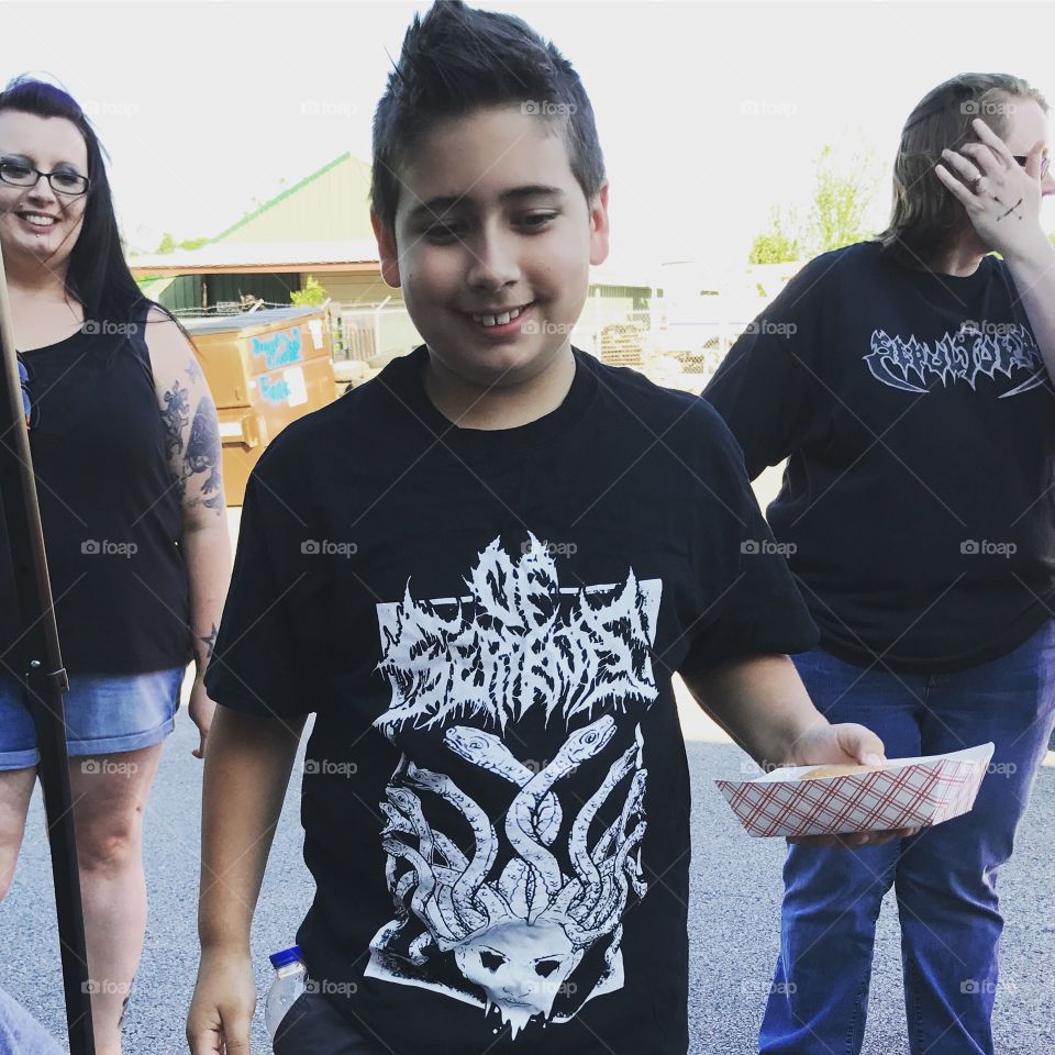 Young Man enjoying his new Of Serpents shirt