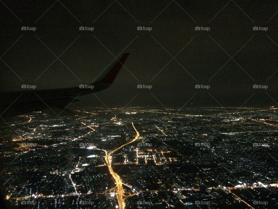 Night city view of Bangkok from the plane