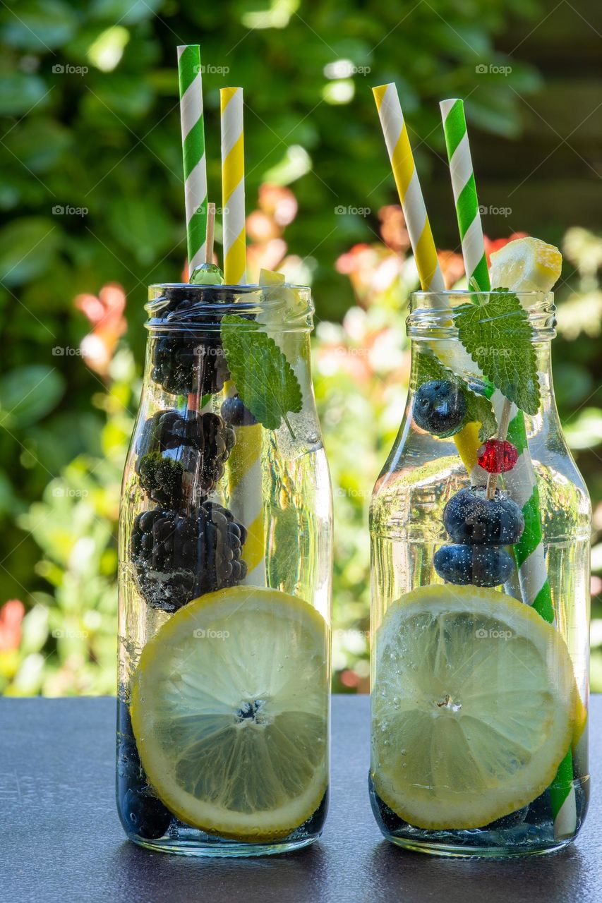 two bottles of water and fruits