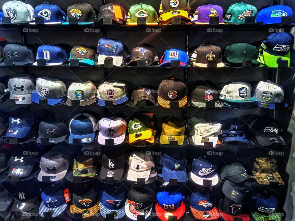 Many Baseball Caps in a row