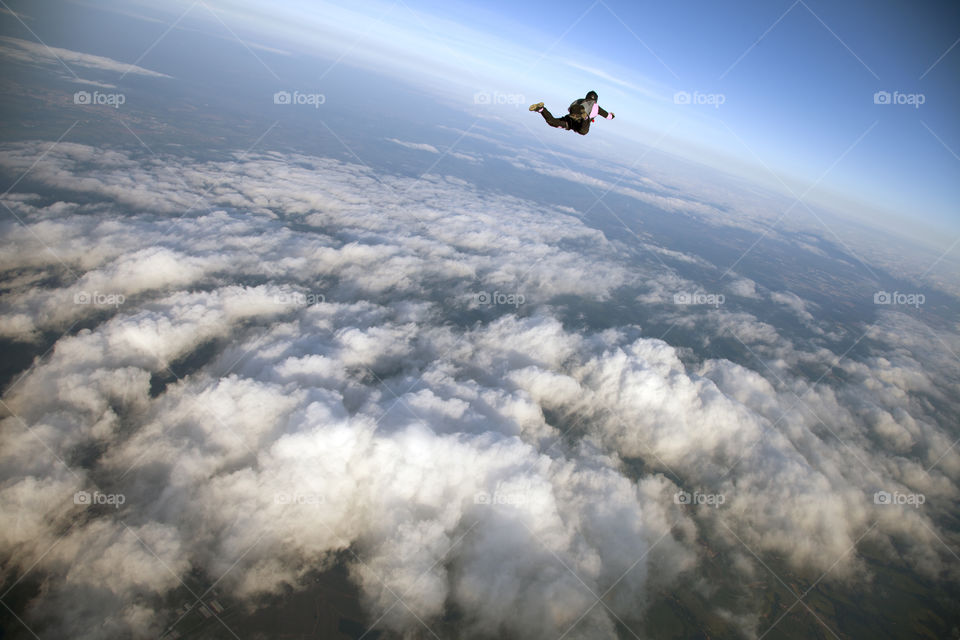 Skydiving over the cloudscape