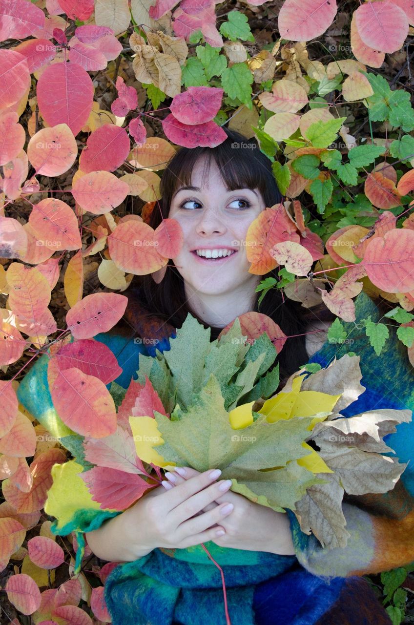 Energetic, Light-Hearted, and Vibrant Portrait of Girl on Autumn Background