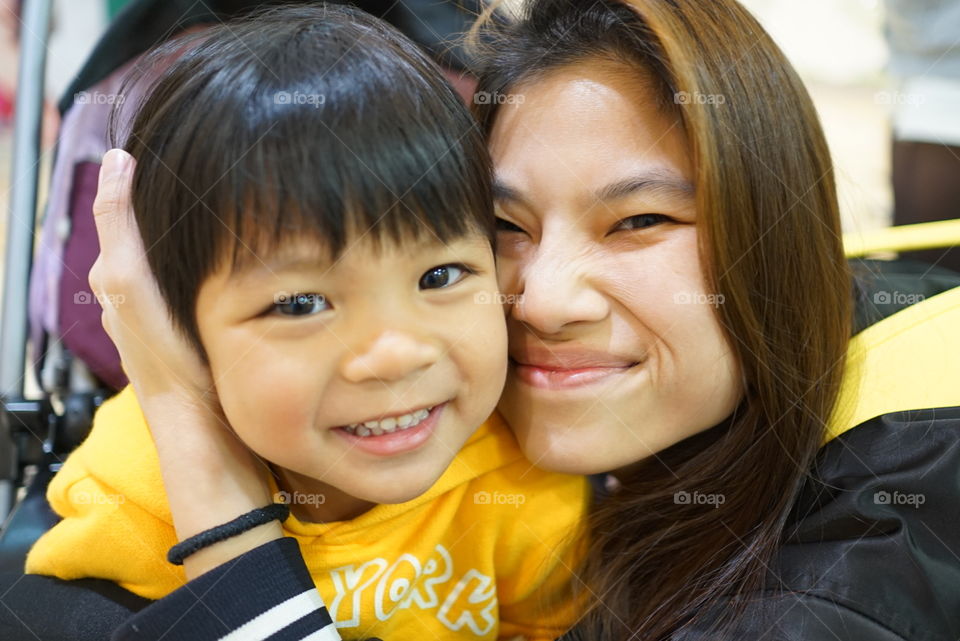 Mother hugging her son
