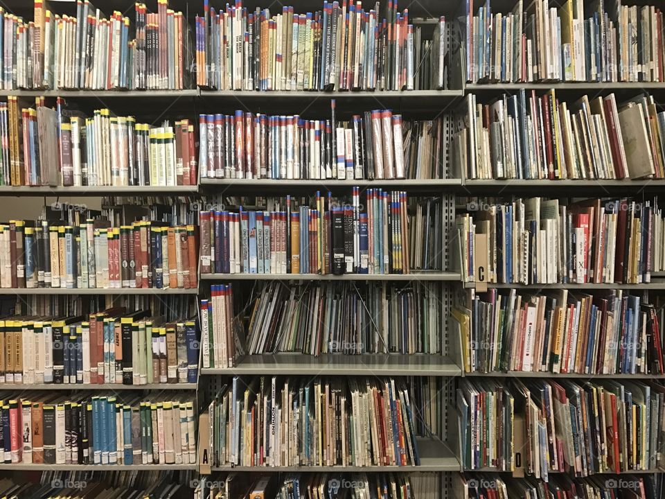 Messy library book shelf 