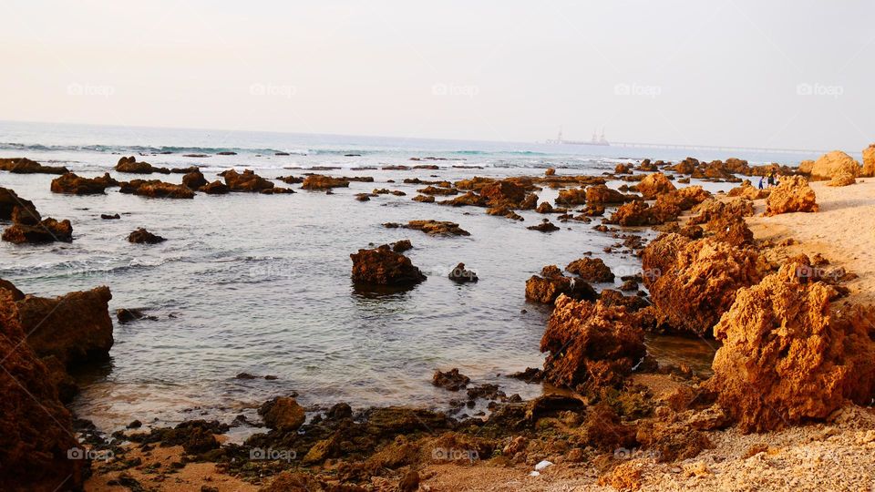 Rocky beach at sunset colours 