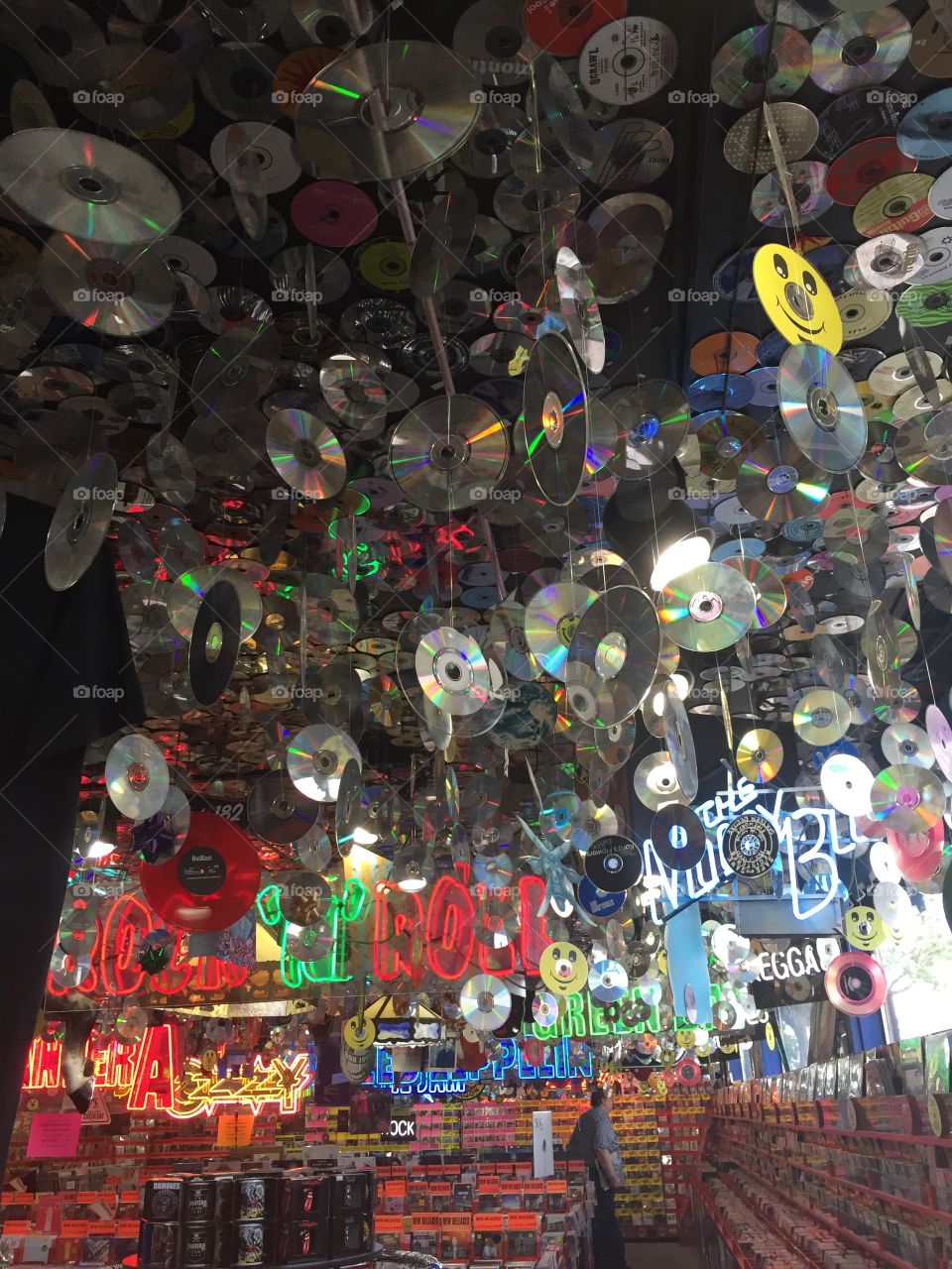 Old fashioned music store ceiling. It has records albums and CDS UP 