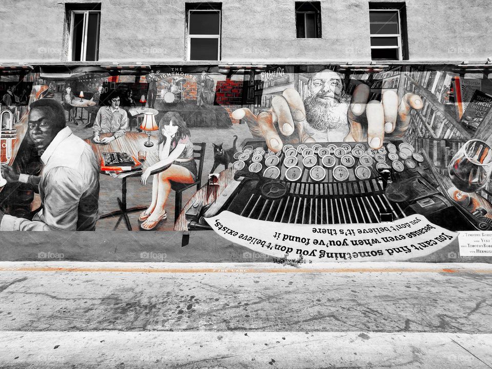 A unique mural occupies most of the side of a building