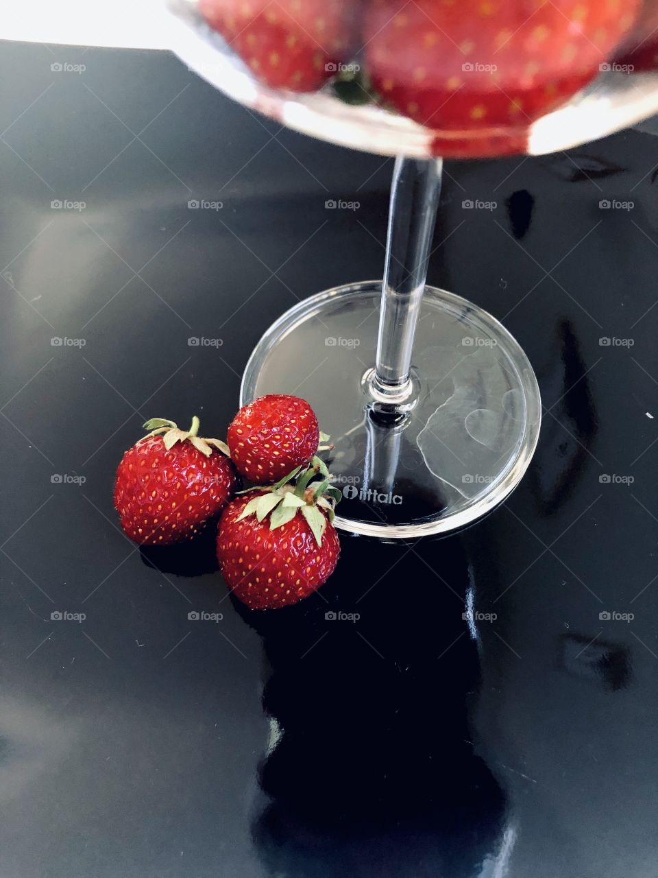 Strawberries with a black background. Summer is here! Less is more. 
