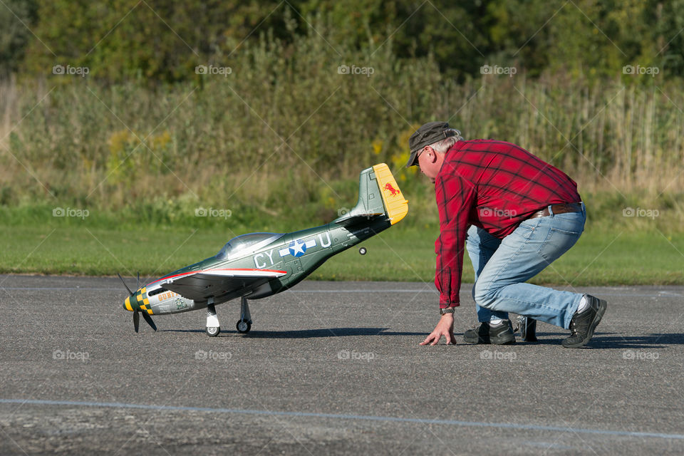 RC hobbie. Friend with his Mustang airplane.